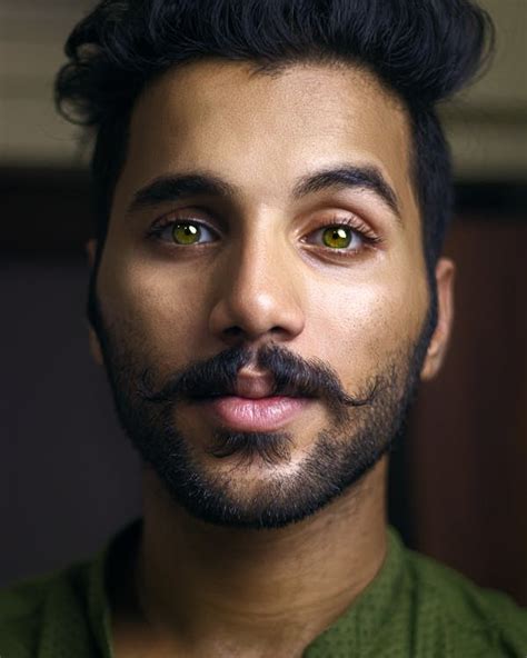 Selective Focus Portrait Photo of Man with Green Eyes Posing · Free Stock Photo