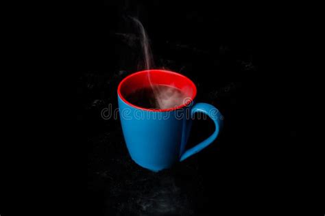 A Blue Cup Of Hot Steaming Coffee Black Background Stock Photo Image