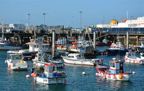 Colourful Small Fishing Boats Moored in a Busy Harbour at St Peter Port ...