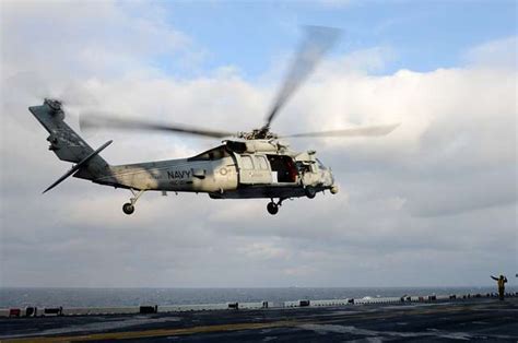 An Mh 60 Sea Hawk Helicopter Departs The Amphibious Assault Ship Uss Bataan Lhd 5 Picryl