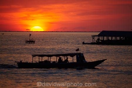 Sunset Over Boat On Tonle Sap Lake At Chong Khneas Floating Village