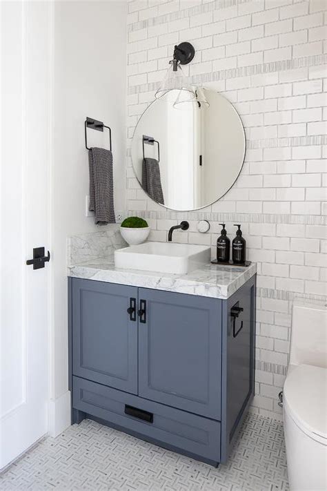 Blue Single Washstand On White And Gray Marble Maze Pattern Tiles