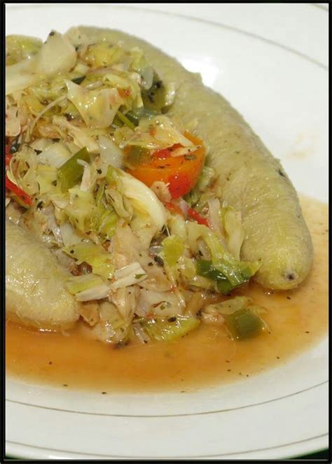 Jamaican Style Cabbage And Saltfish Served With Boiled Green Bananas