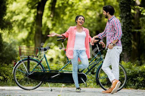 Young Couple By The Tandem Bicycle Stock Photo | Royalty-Free | FreeImages