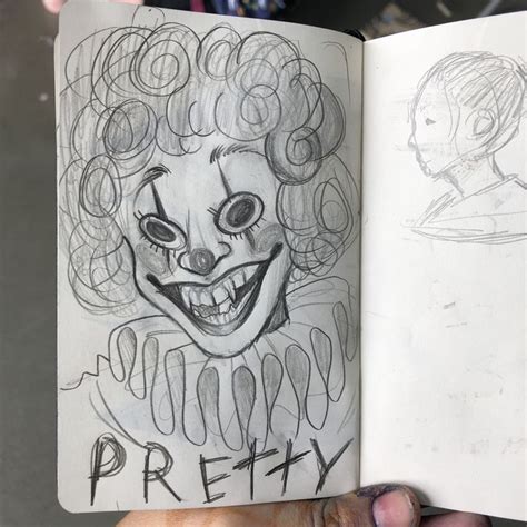 a drawing of a creepy clown is opened to show the inside of an open book