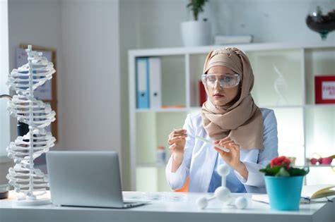 Premium Photo Holding Test Tube Female Chemist Wearing Glasses Holding Test Tube With