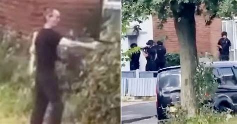 Chilling Moment Man Points Gun At Police Sparking Swat Team To Descend On Street Mirror Online