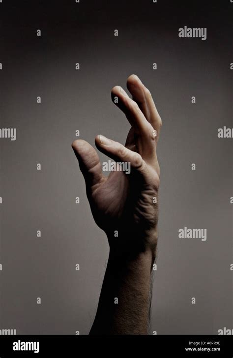 Man S Hand Reaching Up Stock Photo Alamy