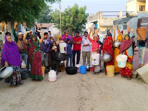 Women Demonstrated With Empty Utensils Demanding A Solution To The