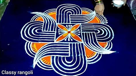 A Person Standing Next To A Blue And Orange Design On The Ground