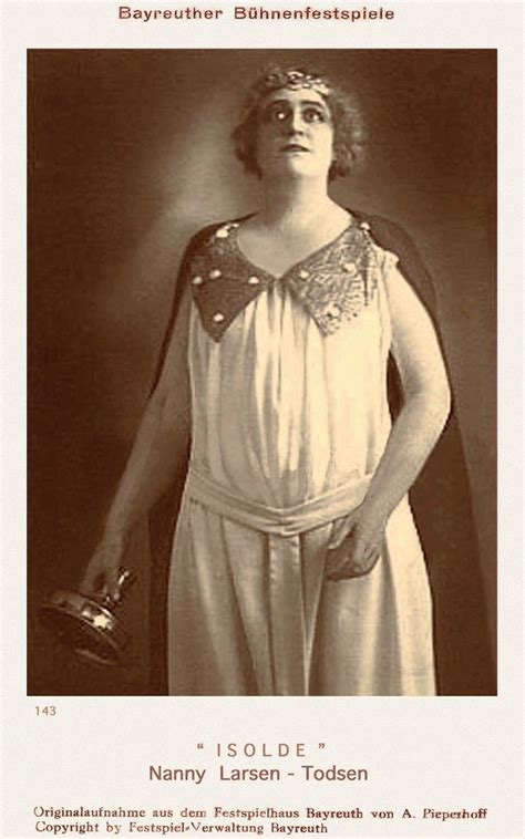 An Old Photo Of A Woman Dressed In Roman Garb And Holding A Glove With