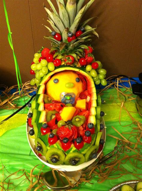 A Fruit Carving Is Displayed On A Table