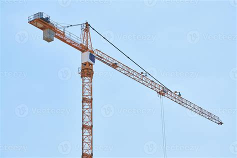 Construction crane working on building complex 9755082 Stock Photo at Vecteezy