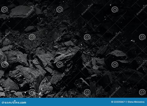 Black Coal And Shovel Lying On A Pile In House Basement Royalty Free