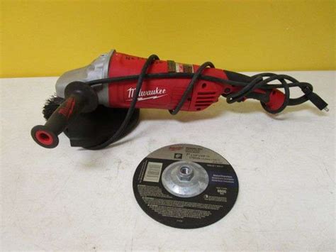 Milwaukee 7" Grinder w/Wheel & Brush - Oberman Auctions