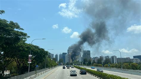 Golden Mile Tower blaze sends thick smoke billowing into sky, involved multiple vehicles at car park