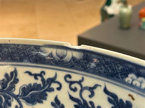 A Large Chinese Blue And White Lotus Scrolls Bowl And Three Famille