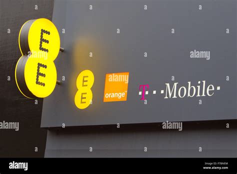 EE Orange & T Mobile mobile network brand logos on high street Stock ...