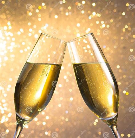 Pair Of A Champagne Flutes With Golden Bubbles On Light Bokeh Background Stock Image Image Of