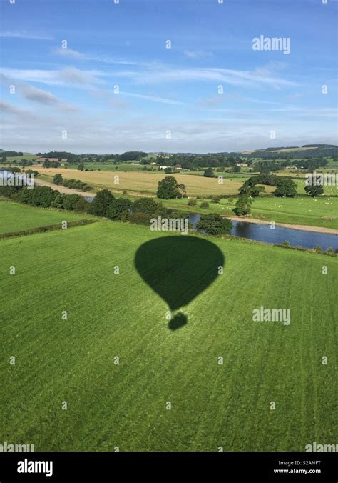 Hot Air Balloon Shadow In Field Stock Photo Alamy