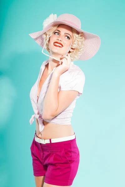 Sexy Blonde Pin Up Girl With Hat And Sunglasses Wearing Pink Shirt And