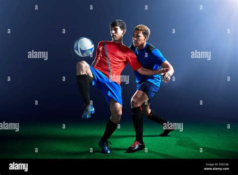 Soccer Player Dribbling Ball Stock Photos And Soccer Player Dribbling