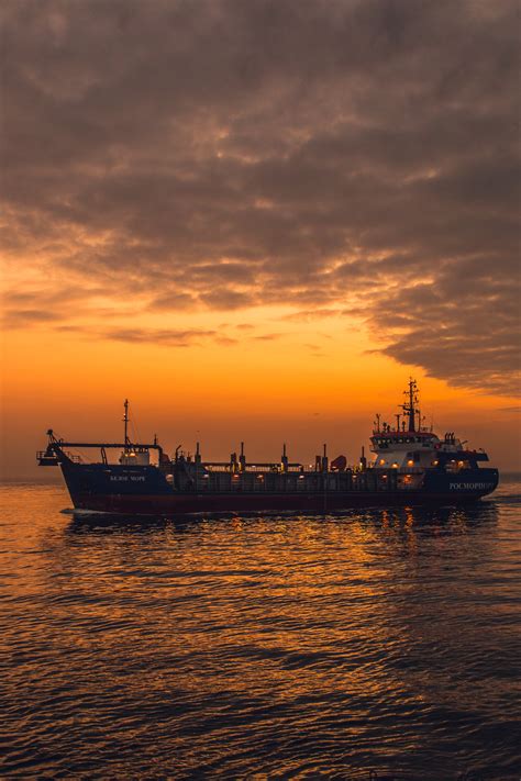 White and Red Cargo Ship on Sea · Free Stock Photo