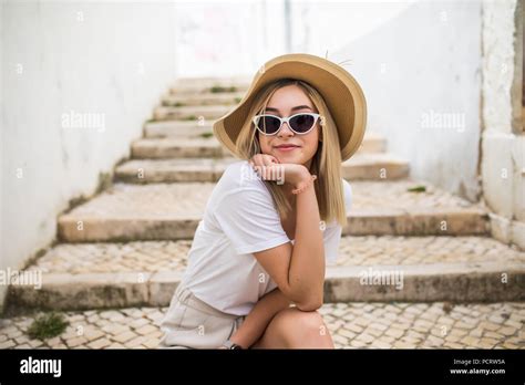 Beautiful Young Caucasian Woman Smiling In Urban Background Blond Girl