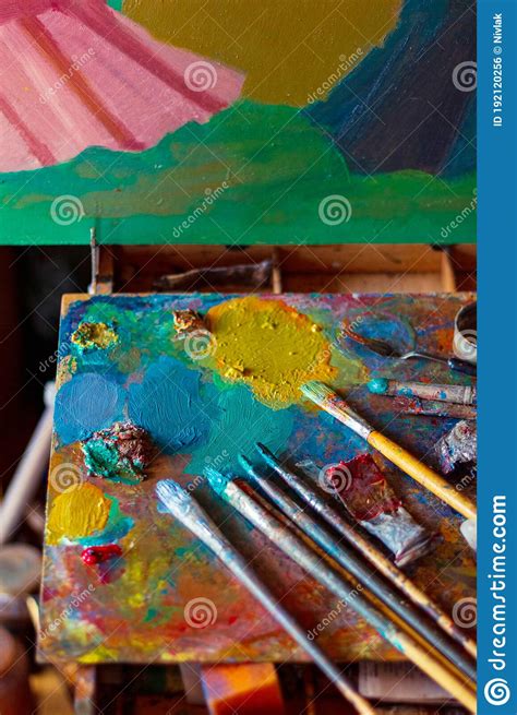 Colorful Artist S Palette With Pastel And Oil Brushes In Art Studio