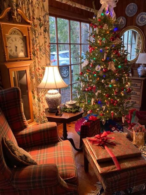 A Living Room With A Christmas Tree In The Corner