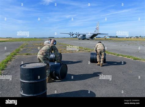 U S Airmen Assigned To The 424th Air Base Squadron Roll Barrels Used