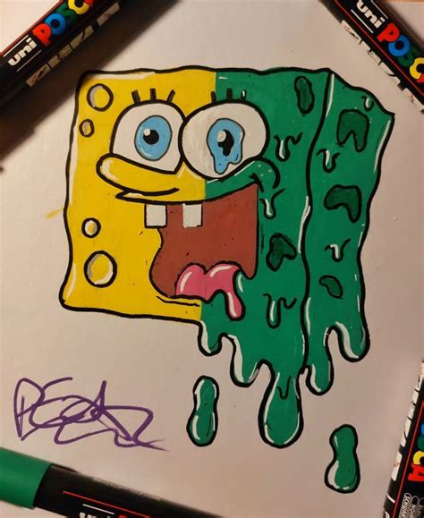 a drawing of spongebob with green and yellow paint