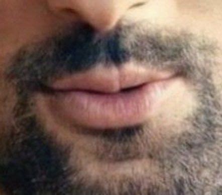 A Close Up Photo Of A Man S Face With A Beard And Moustache