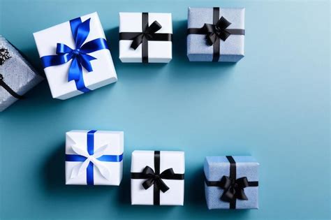 Premium AI Image Four White Gift Boxes With Blue Ribbons And One Has