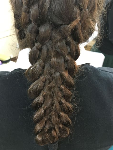 two French four braiders braided down and weaved together at the bottom