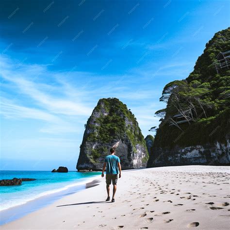 Premium Photo | A man walking at Keling king beach in nusa penida island