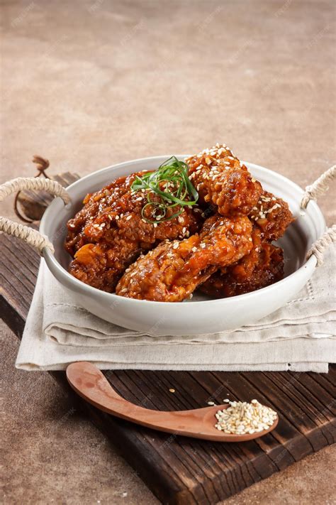 Premium Photo Korean Fried Chicken Yangnyeom Tongdak With Spicy Sauce And Sesame Seed Sayap