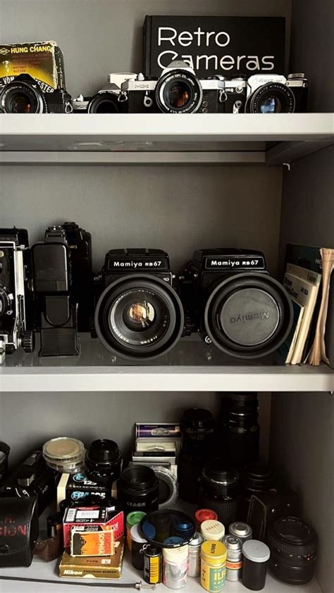 The Shelves Are Filled With Cameras And Other Things To Take Pictures