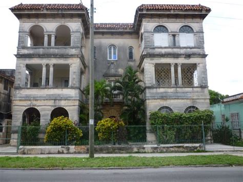 An Old Building With Many Windows And Balconies