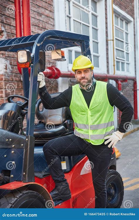 Man Stands Proudly In Front Of His Forklift Stock Image Image Of