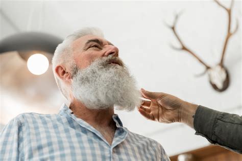 Free Photo | Senior man consulting on beard trimming in salon