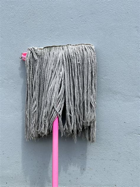 pink mop  concrete background stock photo image  brush concrete