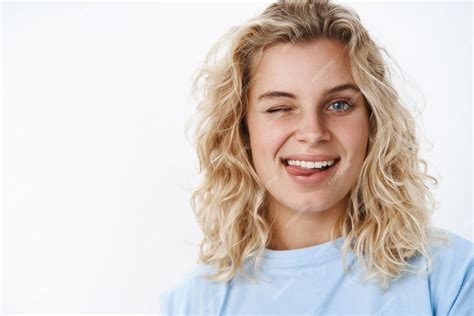 Premium Photo Woman With Blue Eyes And Short Curly Hairstyle Winking