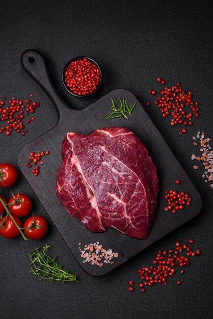 Premium Photo Fresh Raw Beef Steak With Salt Spices And Herbs