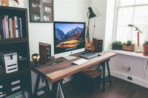 Premium Photo A Computer Desk Features A Keyboard And A Monitor