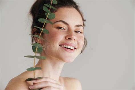 Half Naked Brunette Woman Smiling While Posing With Eucalyptus Stock