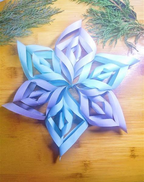 An Origami Snowflake On A Wooden Table