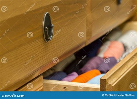 Folded Clothes in Chest of Drawers Closeup Stock Image - Image of color, material: 73424469