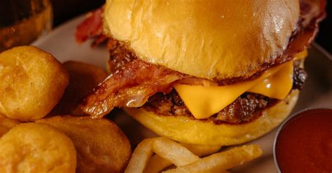 Burger and French Fries Served in a Restaurant · Free Stock Photo