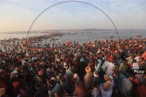 Image Of Crowd Of Hindu Devotees Taking Holy Bath In Triveni Sangam